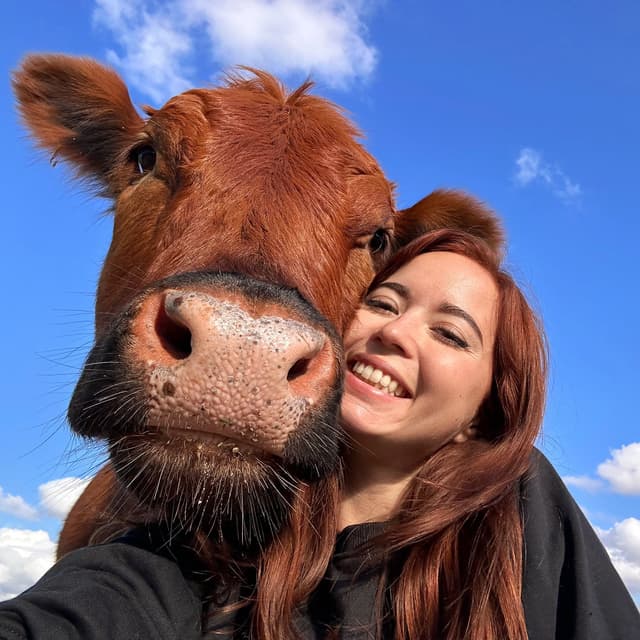 Maya Higa, with Winnie the Moo resting her head on Maya's shoulder